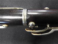 Lot 286 - An unboxed French three sectional polished hardwood clarinet