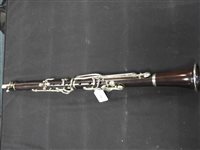 Lot 286 - An unboxed French three sectional polished hardwood clarinet