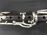 Lot 286 - An unboxed French three sectional polished hardwood clarinet