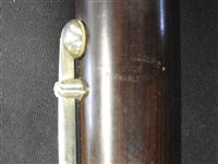 Lot 286 - An unboxed French three sectional polished hardwood clarinet