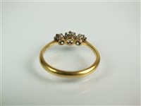 Lot 107 - A three stone diamond ring