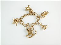 Lot 153 - A 9ct gold charm bracelet