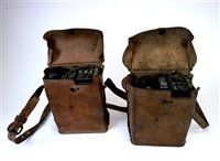 Lot 160 - A pair of second World War period cased Bakelite field telephone sets