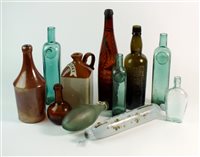 Lot 67 - A collection of glass and stoneware bottles together with a Victorian glass rolling pin