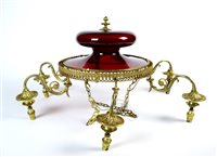 Lot 308 - An Edwardian cranberry glass and brass electrolier