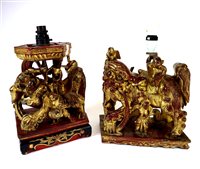 Lot 145 - Two Chinese painted carved hardwood temple lions