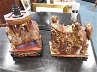 Lot 145 - Two Chinese painted carved hardwood temple lions