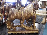 Lot 145 - Two Chinese painted carved hardwood temple lions