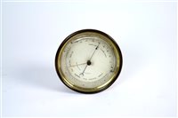 Lot 676 - An Edwardian circular brass cased Aneroid barometer
