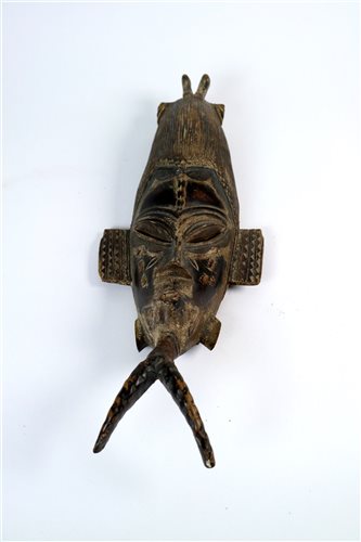 Lot 278 - A group of 20th century painted and carved central African tribal masks