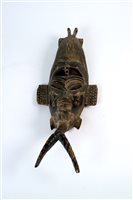 Lot 278 - A group of 20th century painted and carved central African tribal masks