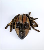 Lot 278 - A group of 20th century painted and carved central African tribal masks