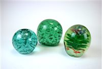 Lot 125 - A collection of Victorian green glass dumps and paperweights