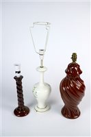 Lot 315 - Nine brown glazed table lamps and two lamps decorated with wild birds