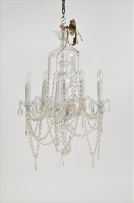 Lot 299 - A matched pair of five-branch clear cut crystal ceiling chandeliers (2)