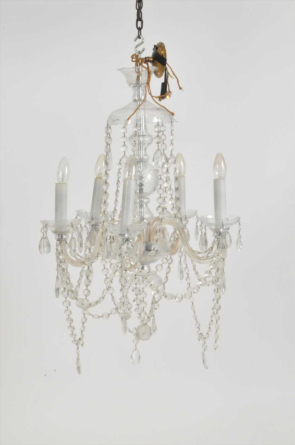 Lot 299 - A matched pair of five-branch clear cut crystal ceiling chandeliers (2)