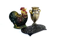 Lot 282 - A decorative pair of painted cast iron door stop in the form of seated hens