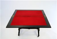 Lot 348 - A Victorian Aesthetic movement ebony fold-over top card table