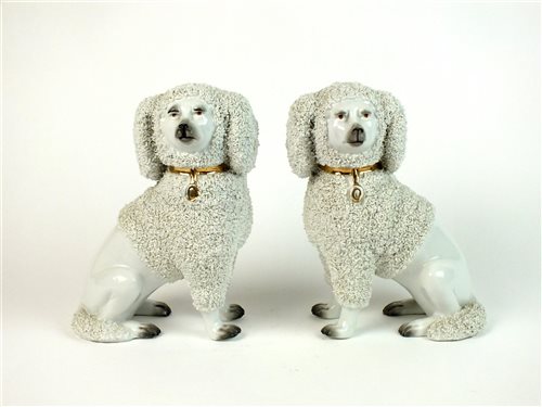 Lot 49 - A pair of Continental porcelain shredded clay poodles