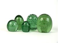 Lot 23 - Five Victorian green glass dump paperweights