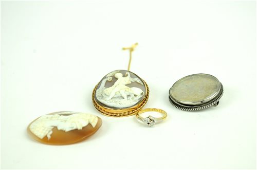 Lot 24 - Three cameos, a ring and a coin brooch