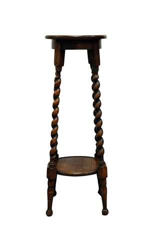 Lot 384 - A stained oak two tier plant stand