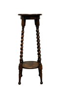 Lot 384 - A stained oak two tier plant stand