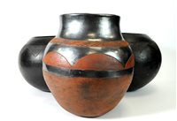 Lot 630 - A large pair of African stoneware vessels