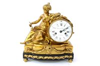 Lot 501 - A French gilt gilt bronze and ebony mantel clock by Dubois