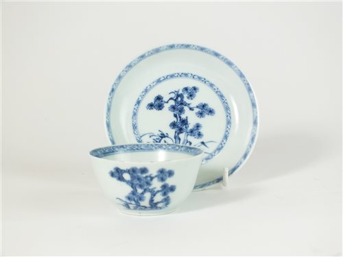 Lot 230 - A Chinese Nanking Cargo blue and white porcelain tea bowl and saucer