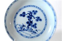 Lot 230 - A Chinese Nanking Cargo blue and white porcelain tea bowl and saucer