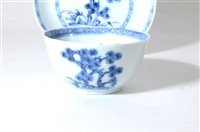 Lot 230 - A Chinese Nanking Cargo blue and white porcelain tea bowl and saucer