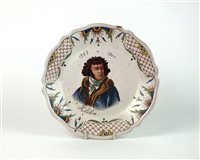 Lot 54 - A 19th century Rouen faience plate