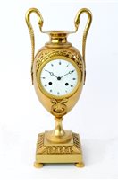 Lot 208 - An Empire ormolu urn clock, early 19th century