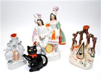 Lot 195 - Five Staffordshire figures and a novelty cat teapot and cover