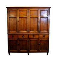 Lot 547 - A Regency oak and ebony strung house keeper’s cupboard