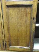 Lot 547 - A Regency oak and ebony strung house keeper’s cupboard