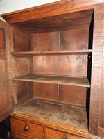 Lot 547 - A Regency oak and ebony strung house keeper’s cupboard