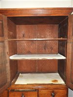 Lot 547 - A Regency oak and ebony strung house keeper’s cupboard