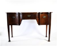 Lot 692 - A 19th century serpentine fronted mahogany side board
