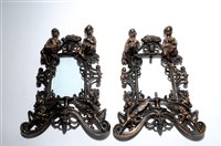 Lot 156 - A decorative pair of Victorian cast metal easel back photograph frames