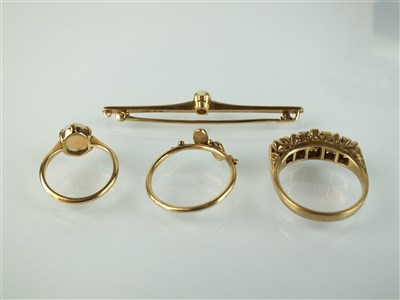 Lot 193 - Three opal rings and an opal bar brooch