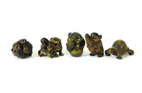 Lot 603 - A group of five carved Chinese and Japanese hardwood Netski