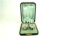 Lot 15 - Two cased sets of silver sauce boats and plated cruets