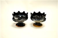Lot 105 - A pair of Czecholslovakian pressed 'slag' glass bowls on stands