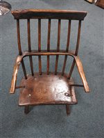 Lot 524 - An elm and ash vernacular stick back chair