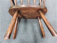 Lot 524 - An elm and ash vernacular stick back chair