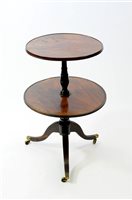 Lot 919 - A Regency mahogany and simulated rosewood two tier dumb waiter
