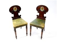 Lot 512 - A pair of Regency mahogany hall chairs, in the manner of Gillows