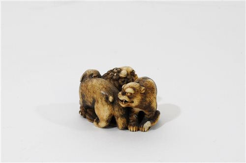 Lot 312 - A Japanese carved ivory okimono of a shishi